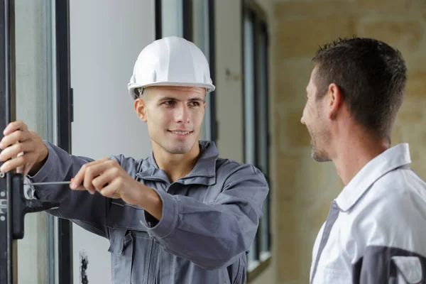 two happy windows installation workers