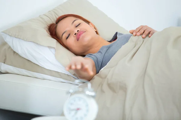 Half Asleep Woman Trying Reach Alarm Clock — 스톡 사진