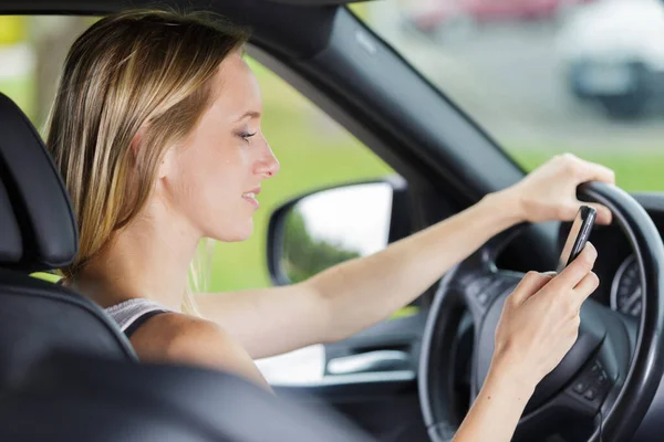 Woman Driver Using Her Phone — Stok fotoğraf