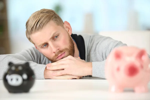 Young Man Piggy Bank Making Serious Face Thinking — Stok fotoğraf