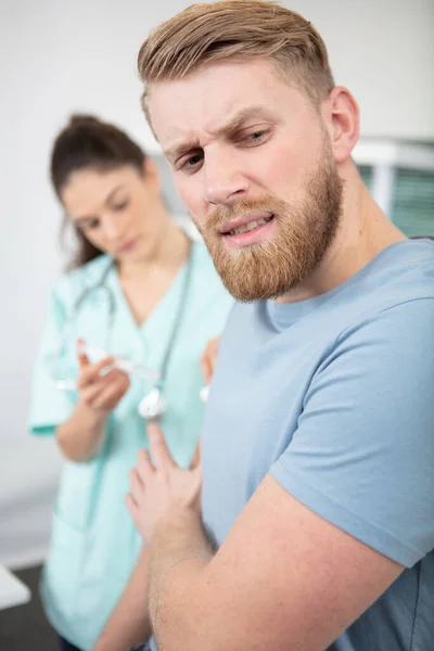 Man Looks Away Nurse Prepares Syringe — Stock fotografie