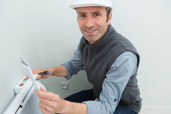 Man Fixing Industrial Heater — Stock Photo, Image
