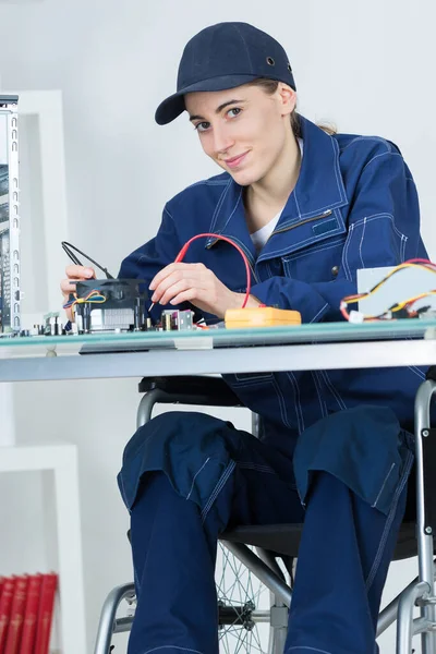 Female Electronician Wheelchair Repairing Computer Motherboard — Stock Photo, Image