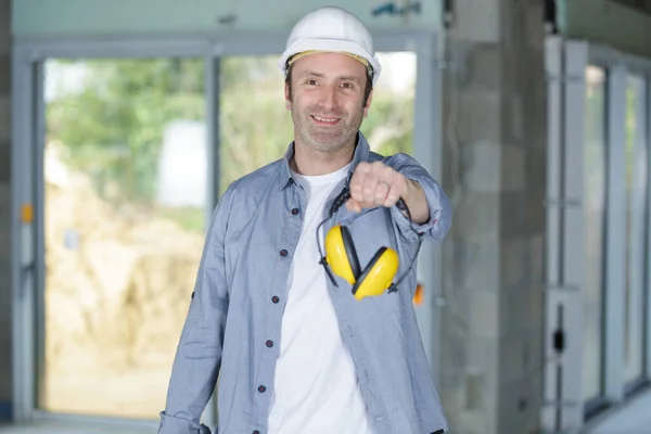 Construction Worker Holding Safety Headphones — Stock Photo, Image