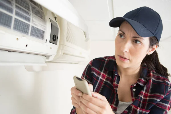 cleaning air conditioning and woman