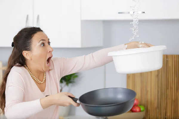 Shocked Woman Collecting Water Leaking Ceiling Using Utensil — Stock Photo, Image