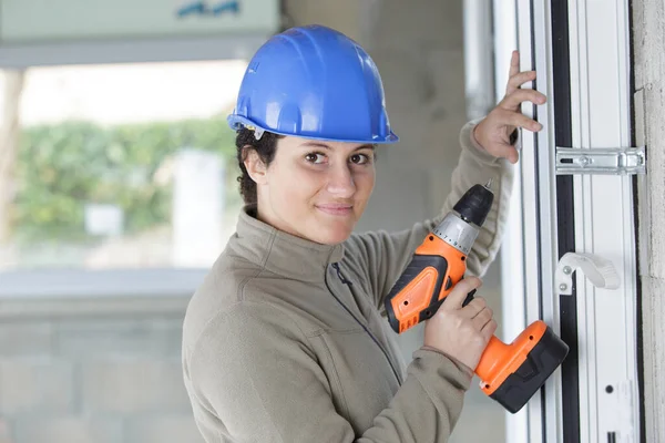 Pretty Young Smiling Woman Holding Cordless Drill — Stock Photo, Image