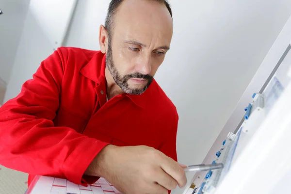 Portrait Electrician Standing Next Fuseboard — Stock Photo, Image