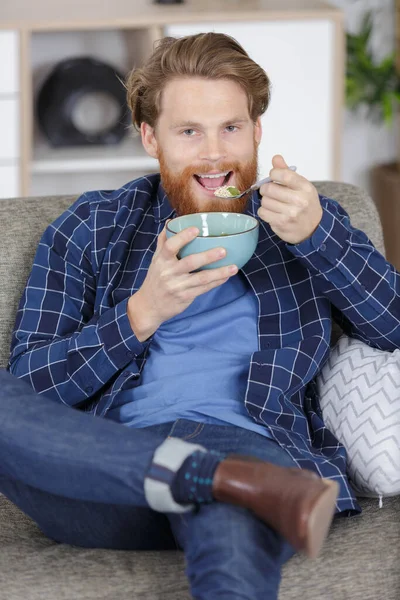 Unemployed Man Eating Cereal Watches Television — Stock Photo, Image