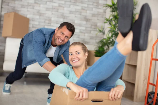 Couple Having Fun Riding Boxes New Home — Stock Photo, Image