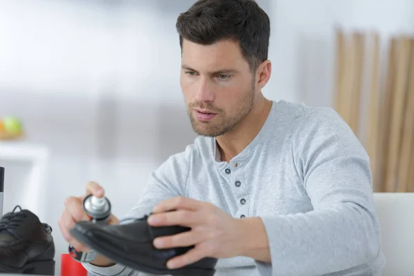 Man Cleaning Combat Shoes — Stock Photo, Image