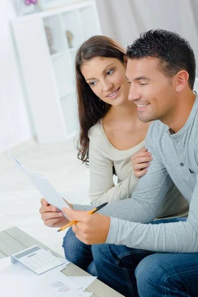 Attractive Couple Doing Paperwork Stock Photo