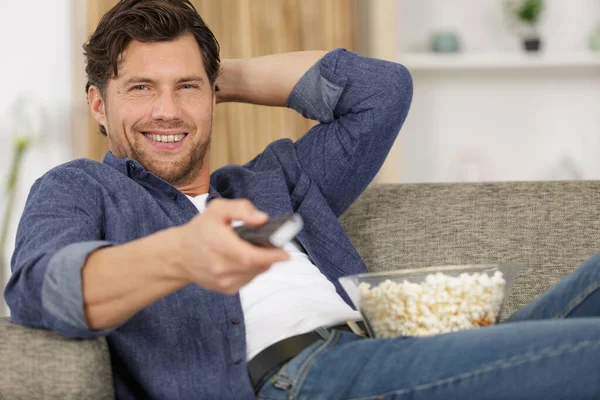 Happy Man Watching Sofa — Stock Photo, Image