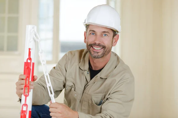 Happy Builder Holding Clipboard While Working Indoors — Stock Photo, Image