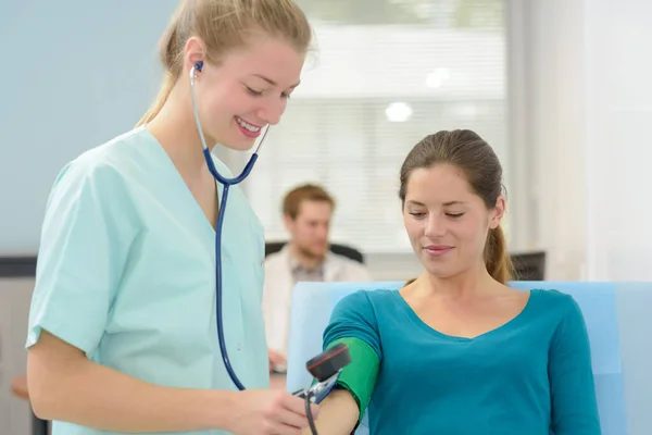 Doctor Taking Blood Pressure Female Patient Office — Stock Photo, Image