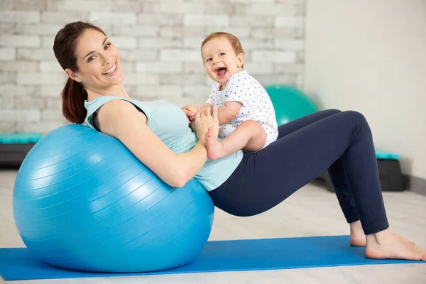 Cute Child Girl Stretching Pilates Fitness Ball Mother — Stockfoto
