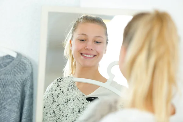 Woman Holding Garment Looking Mirror — Stock Photo, Image