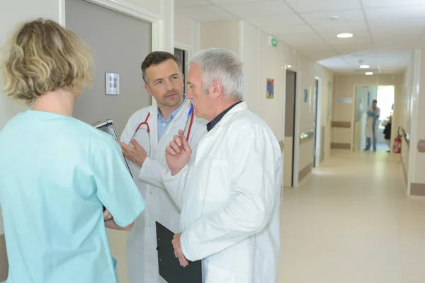 Medical Staff Conferring Hospital Corridor — Stok fotoğraf