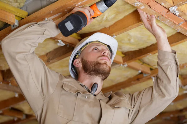 Happy Builder Drilling Wood Ceiling — Foto Stock