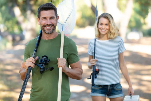 Happy Couple Walking Rods Going Fishing — Stok fotoğraf
