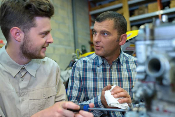 engineers talking on phone in factory