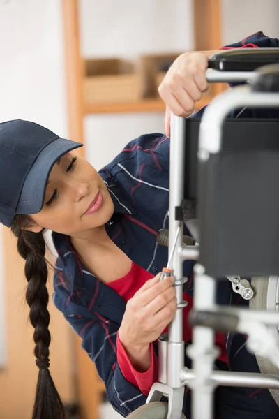 Woman Assembling Wheelchair Workshop — Foto de Stock