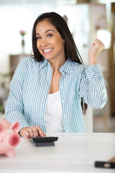 happy woman with a calculator