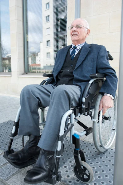 an elderly handicapped man outdoors
