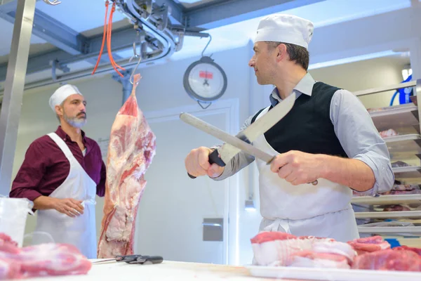 Two Butcher Slicing Ham Smiling Store — 스톡 사진