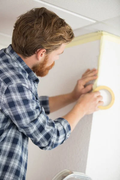 Handyman Prepares Walls Painting Masking Tape — Stock Fotó