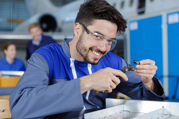 Male Worker Holds Tool — Fotografia de Stock