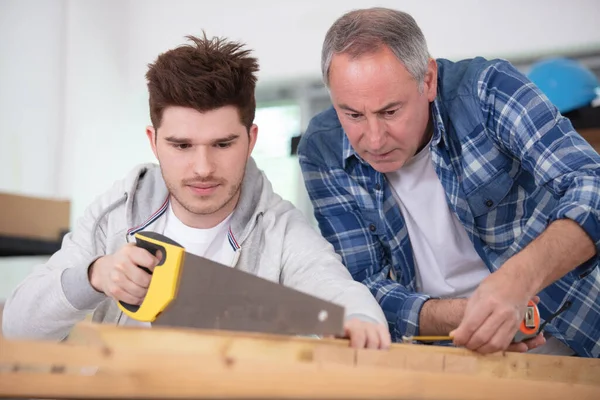 Experienced Male Teacher Carpentry Skill Acquaints Teenager — Zdjęcie stockowe