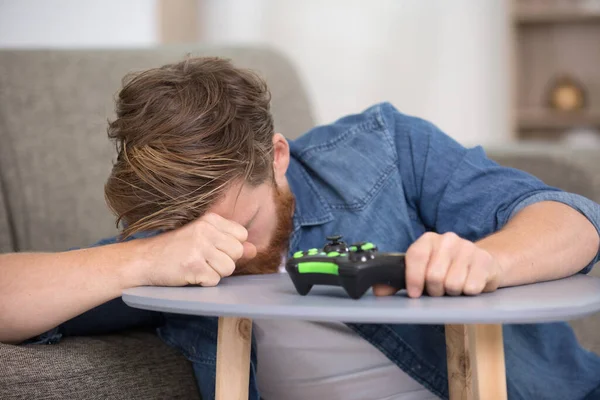 portrait of upset angry guy playing videogames
