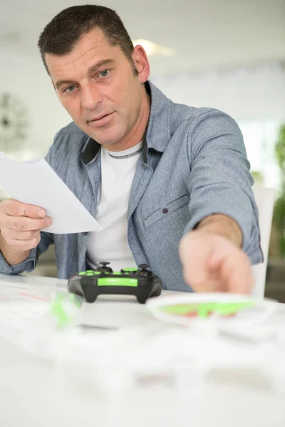 service man working with drones at home