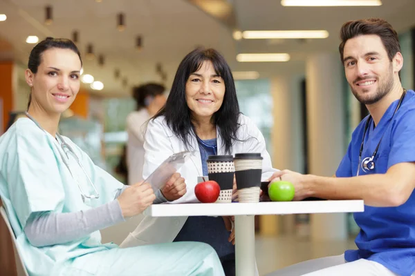 doctor team with apple and coffee