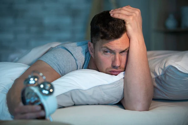 Unhappy Sad Disappointed Man Holds Alarm Clock — Stock Photo, Image