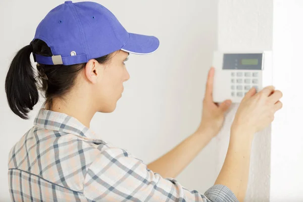 Female Engineer Programming Electronic Keypad — Stock Photo, Image