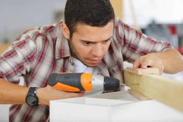 Young Man Drilling Wood Drill Home — Stock Photo, Image