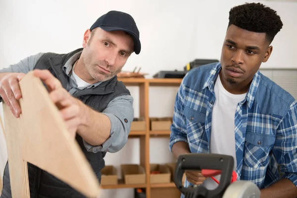 Craftsman Showing Wooden Template Male Apprentice — Stock Photo, Image