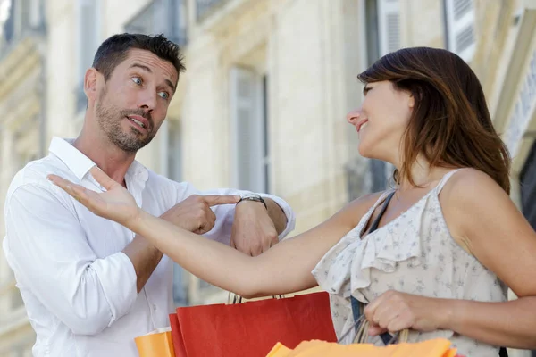 Young Couple Shopping Together Man Looking Watch Royalty Free Stock Photos