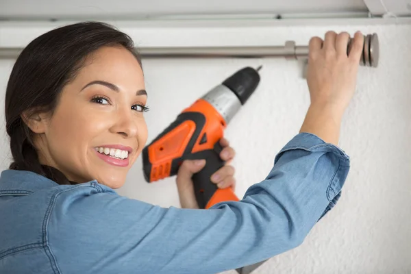 Woman Using Cordless Screwdriver Secure Curtain Rail — Stock Photo, Image