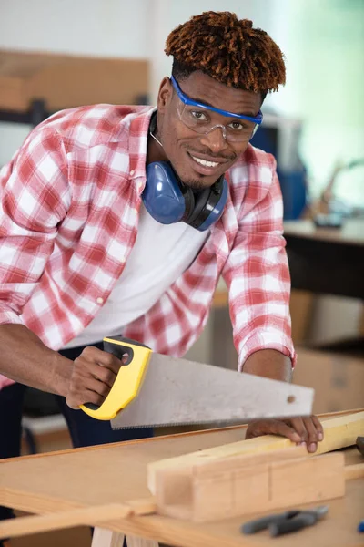 Happy Male Worker Cutting Wood — Stock Photo, Image