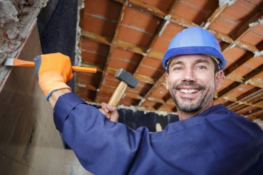 man using a hammer and chisel clipart