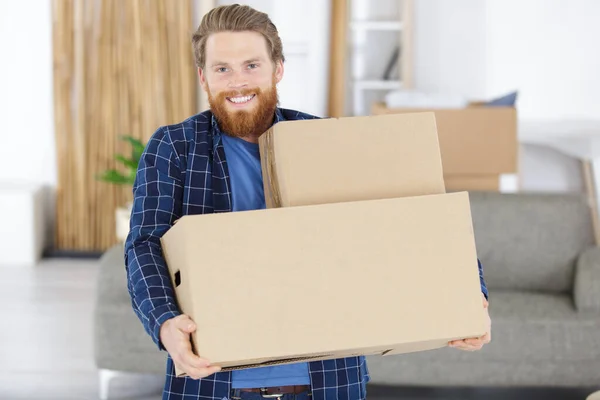 Casual Young Man Holding Boxes — Stock Photo, Image