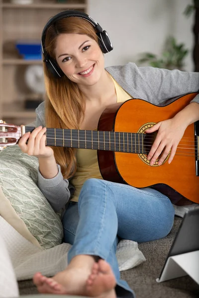 Attractive Girl Wearing White Headphones Playing Guitar — Stock Photo, Image