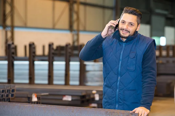 factory worker using telephone