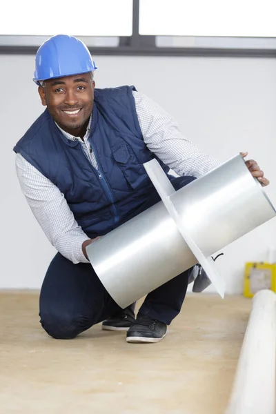 Happy Handsome Builder Holding Metal Conduct — Stock Photo, Image