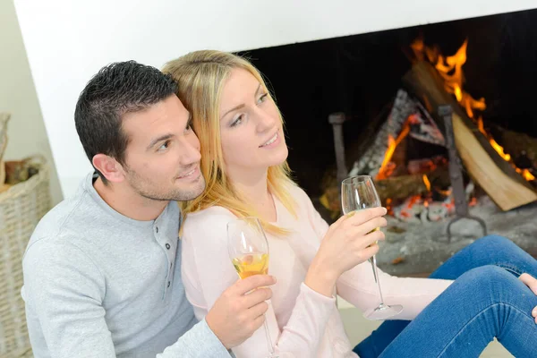 Young couple by the fireplace