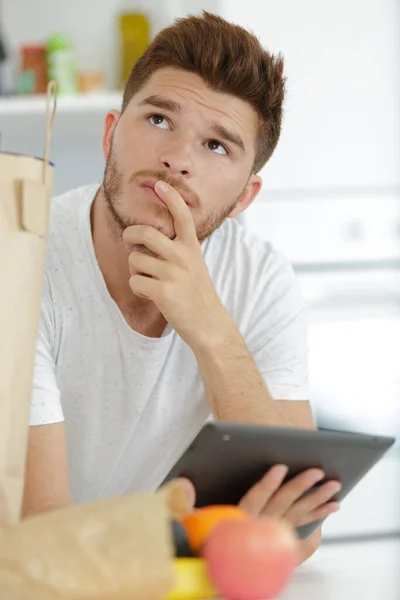 Bored Hipster Man Using Tablet Computer — Stock Photo, Image