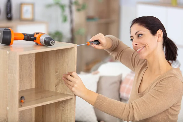 Cheerful Woman Assembles Home Furniture — Stock Photo, Image